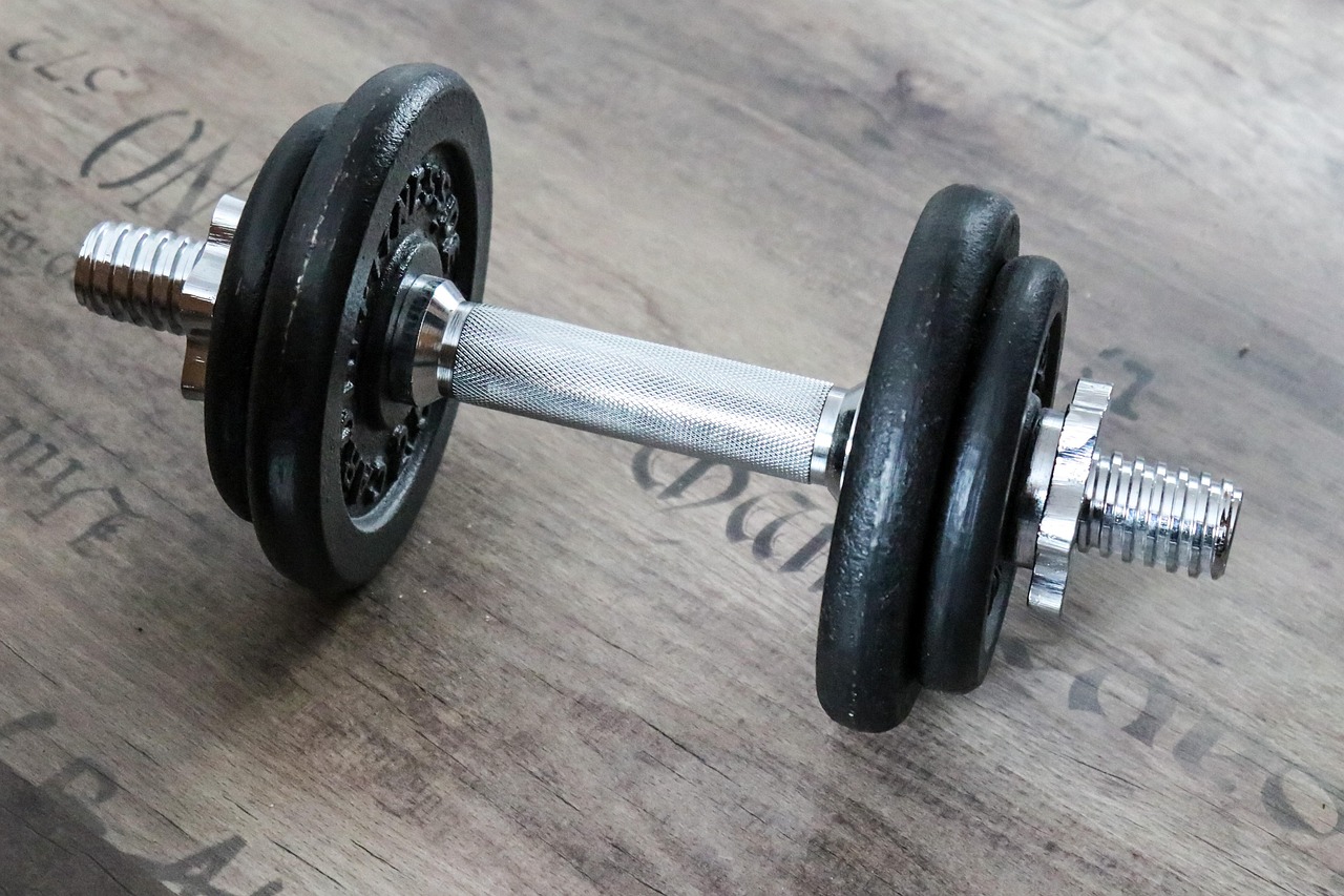 Adjustable dumbbell with weight dial mechanism