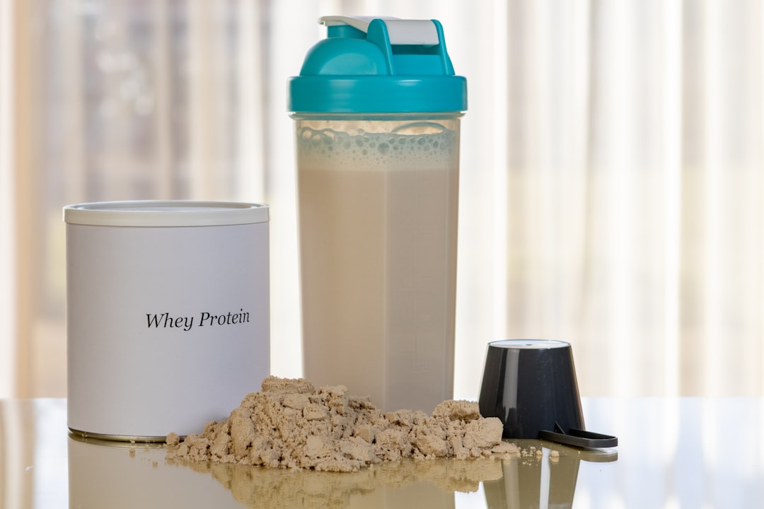 whey protein scoop in shaker bottle