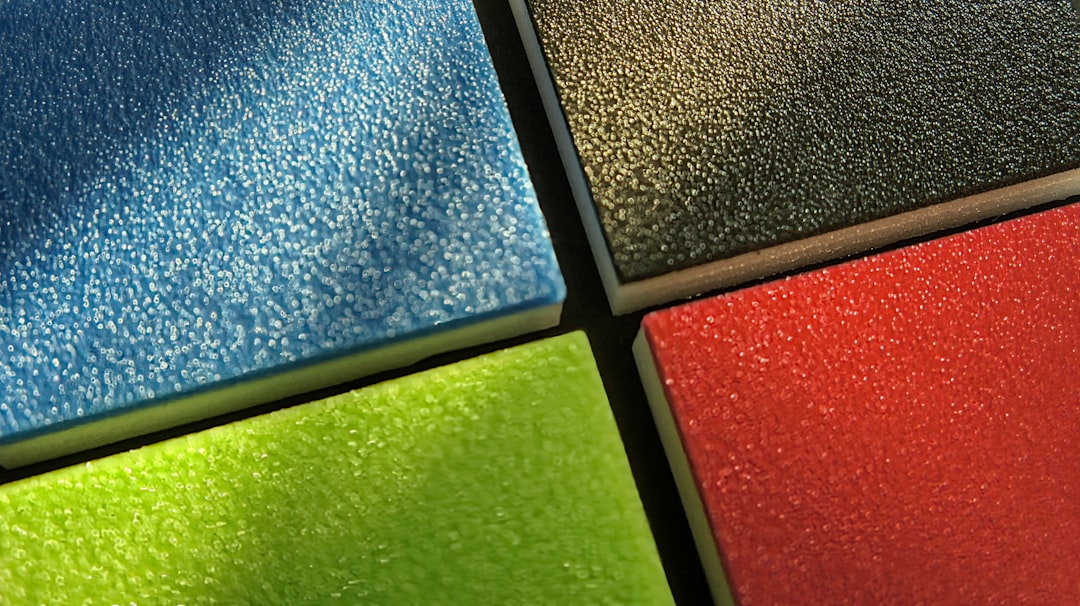 Interlocking foam exercise tiles laid out in a home gym