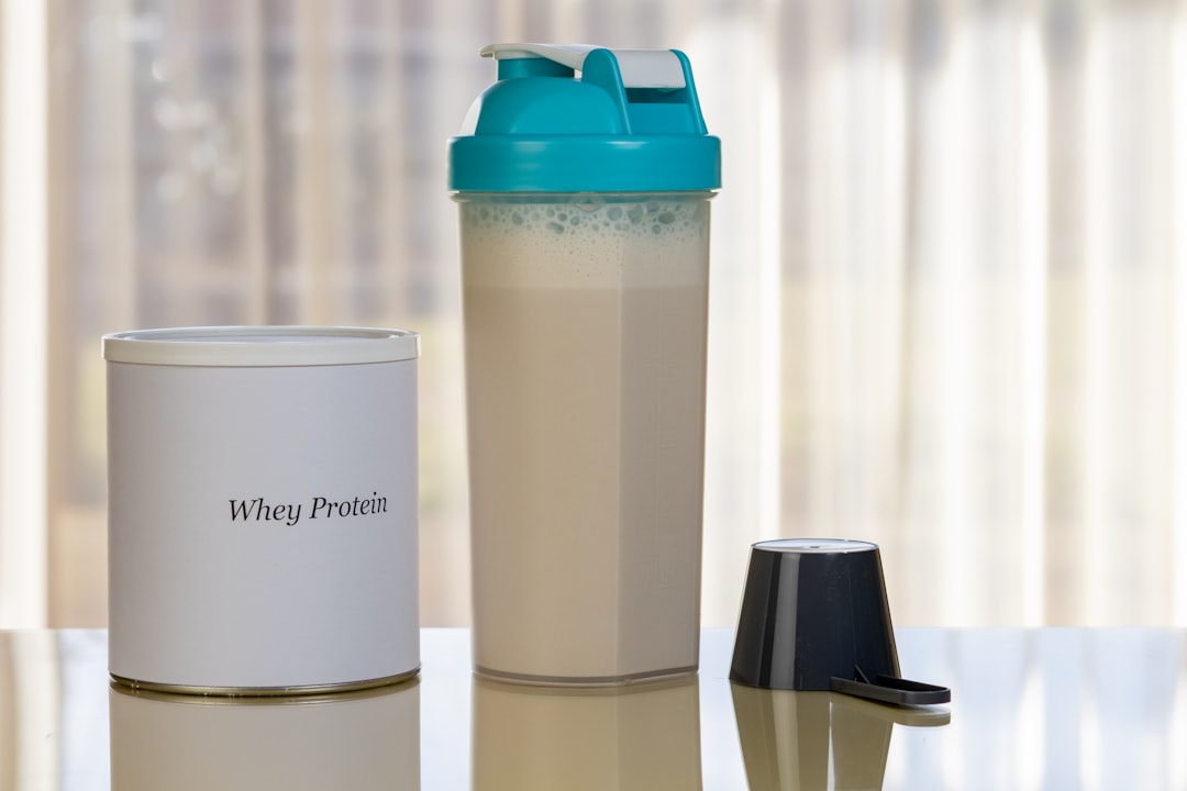 Protein powder in shaker bottle ready to mix