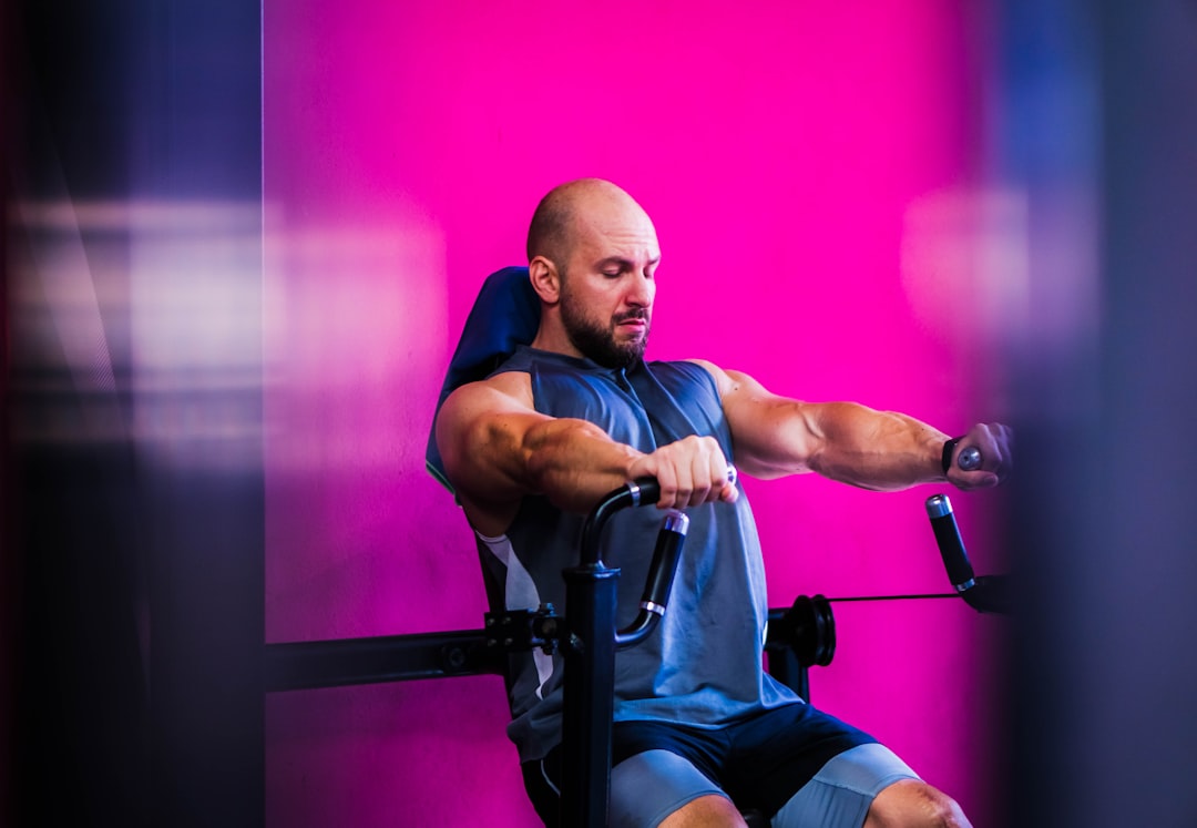 Person doing seated row with resistance band