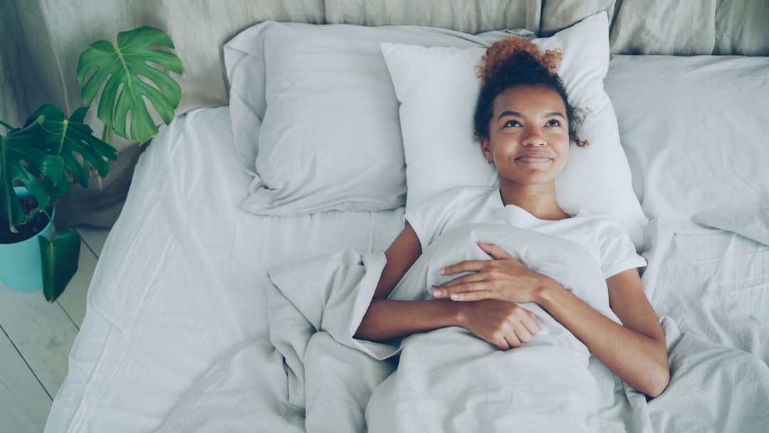 Woman sleeping peacefully in comfortable bedroom