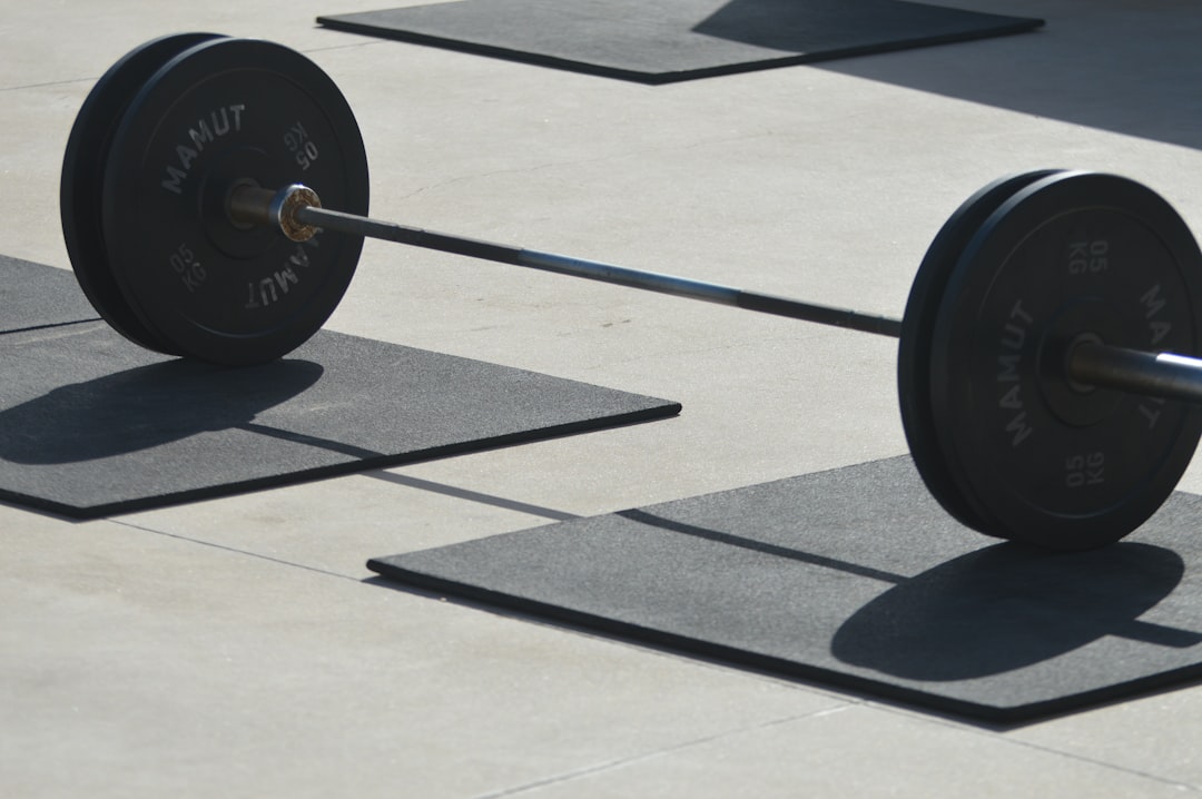 Heavy weightlifting setup on rubber gym flooring