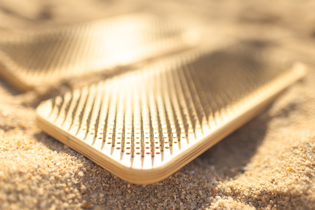 Outdoor yoga practice on beach with mat