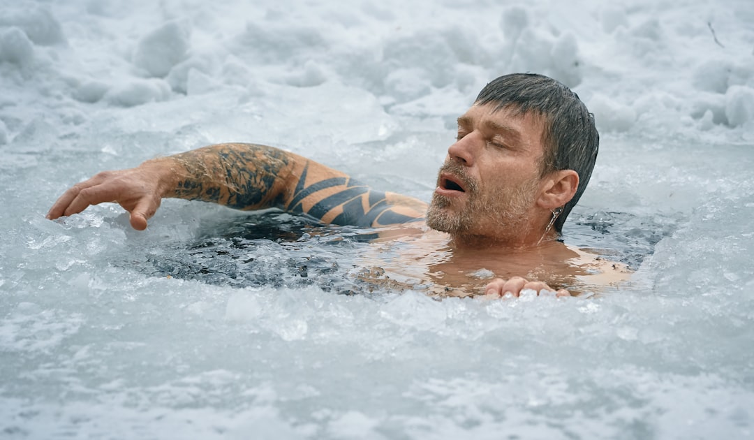 Athlete recovering in cold water immersion therapy