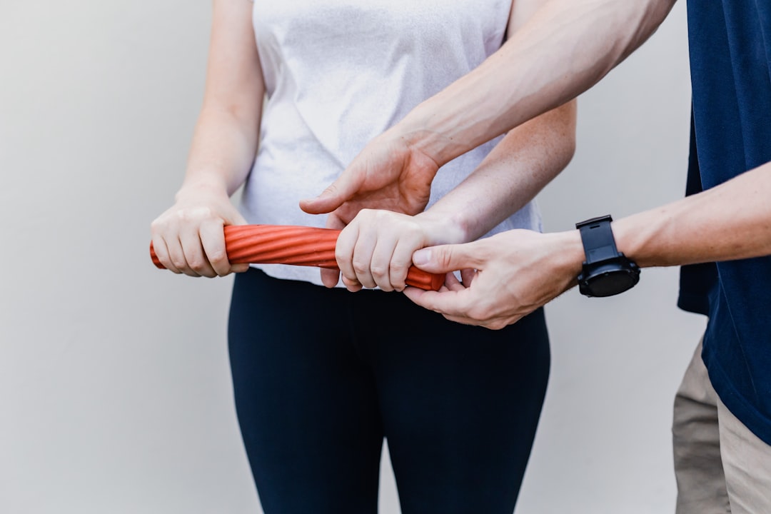 Person using foam roller on legs during workout recovery