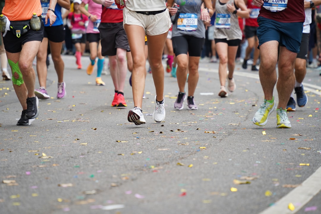 Runner crossing the finish line after completing a marathon race