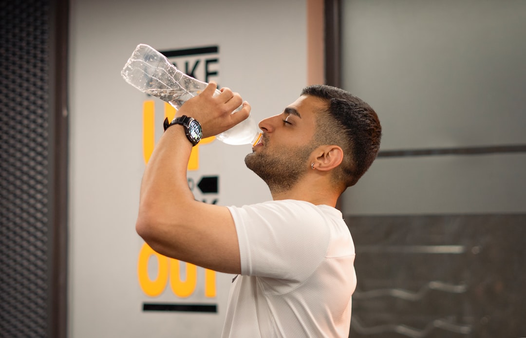 water bottle beside gym workout equipment