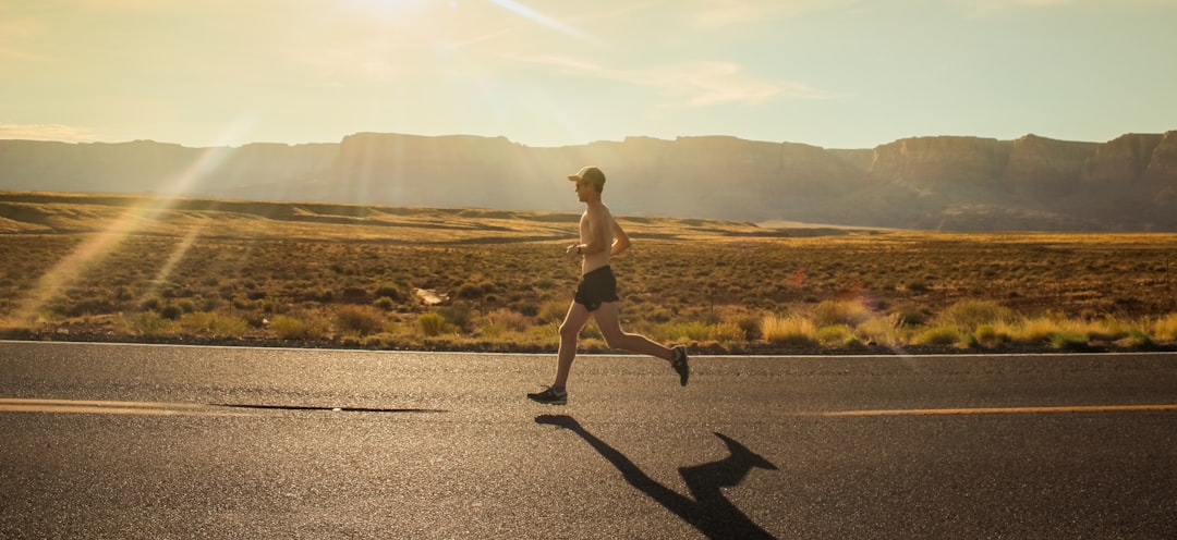 Runner training outdoors during warm summer morning