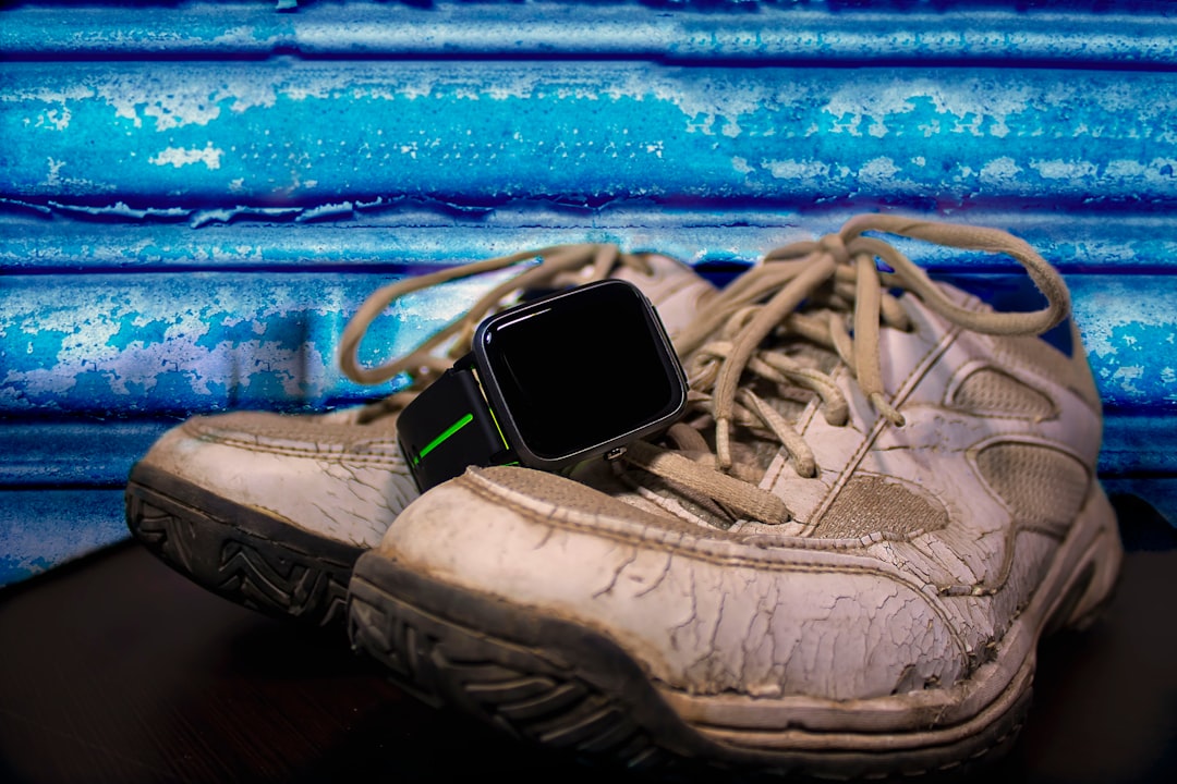 Wearable fitness tracker displaying recovery metrics and HRV data on screen