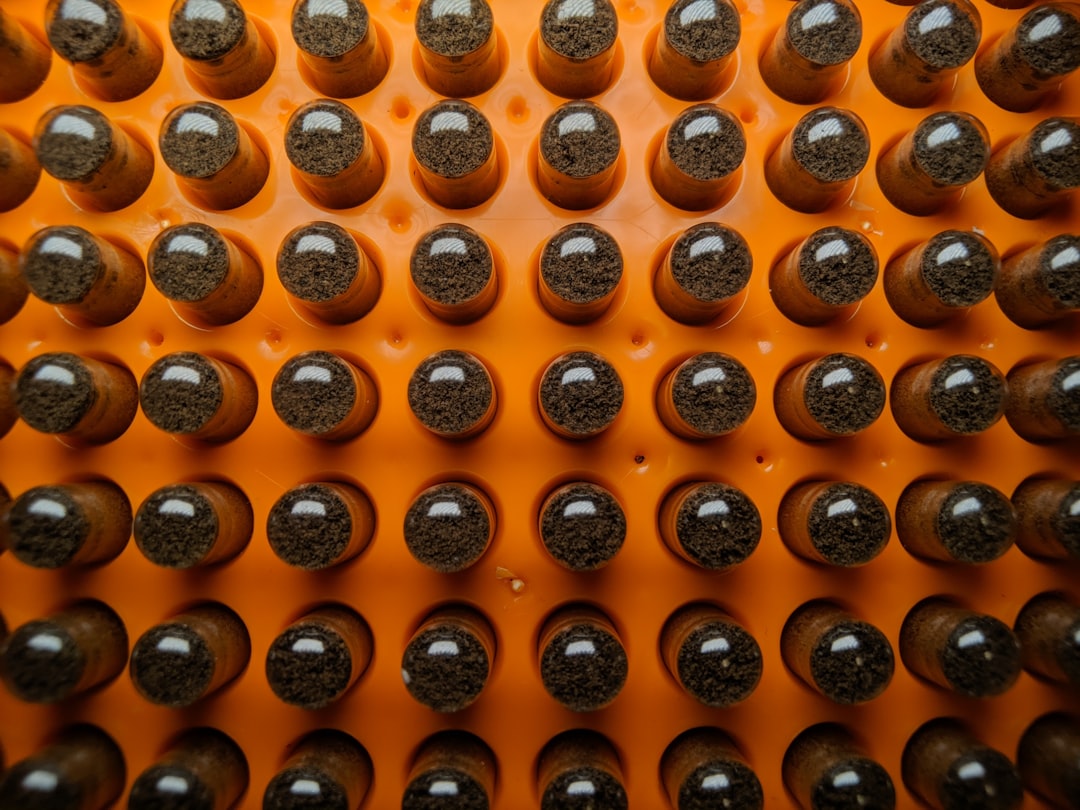 Woman relaxing on acupressure mat in peaceful evening setting
