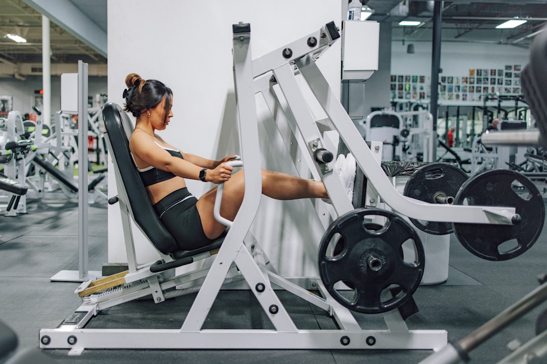 Woman stretching legs after gym workout session