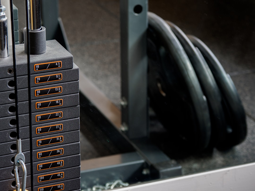 Plate-loaded cable machine in home gym