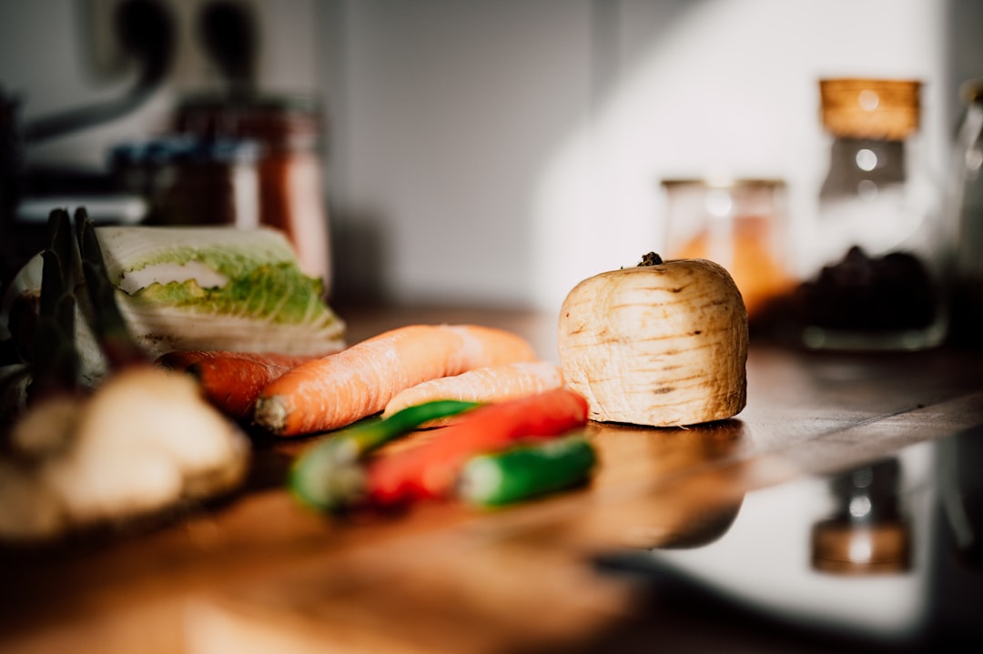 Colorful healthy meal prep with vegetables and protein on a kitchen counter