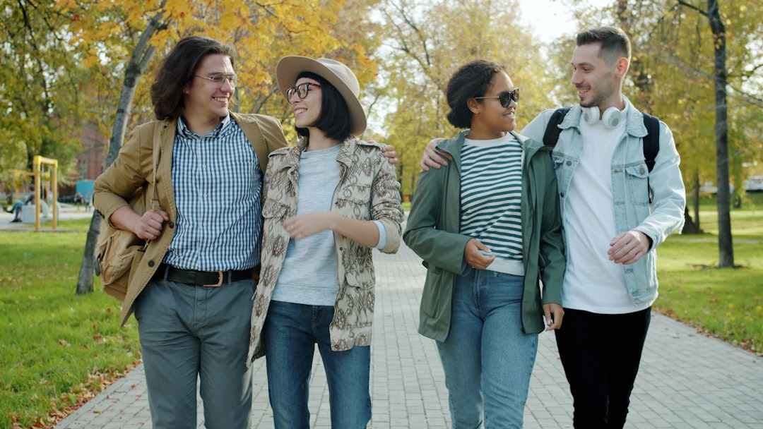 Friends walking together outdoors laughing and enjoying nature