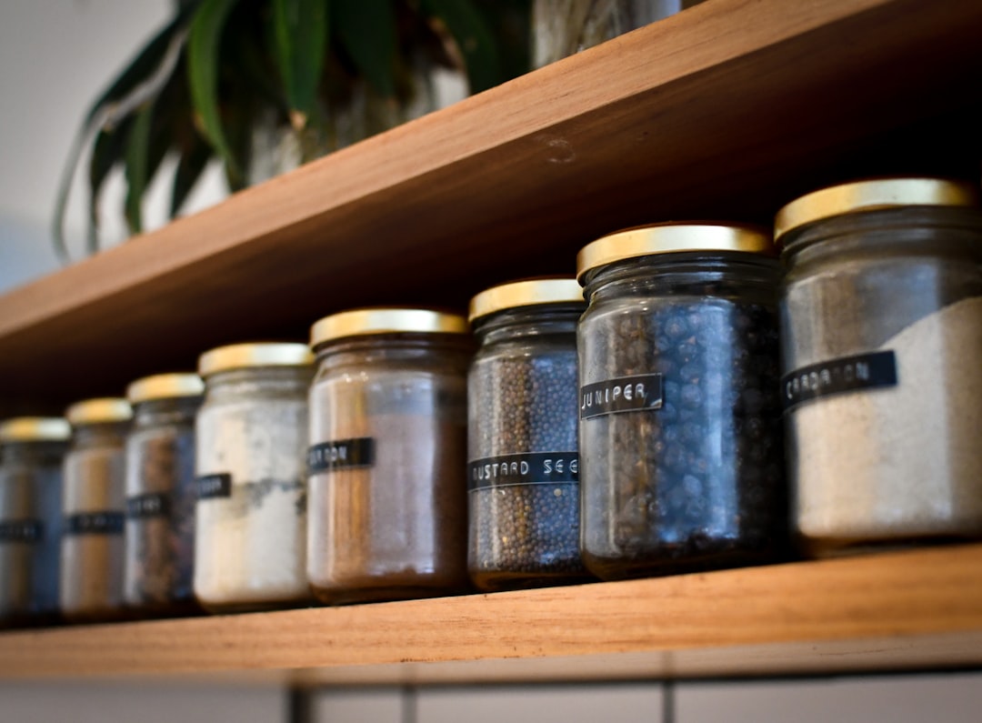Supplement jars organized on a kitchen shelf