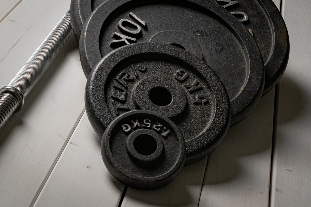 Weight plates loaded on a barbell for strength training