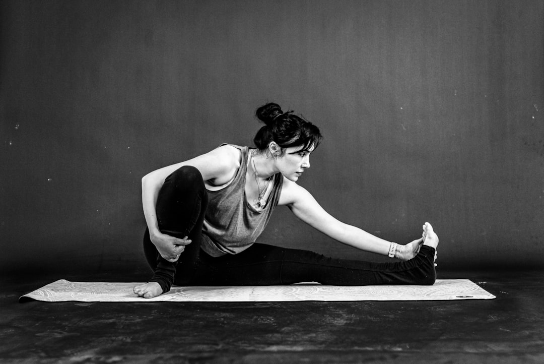 woman athlete stretching during recovery