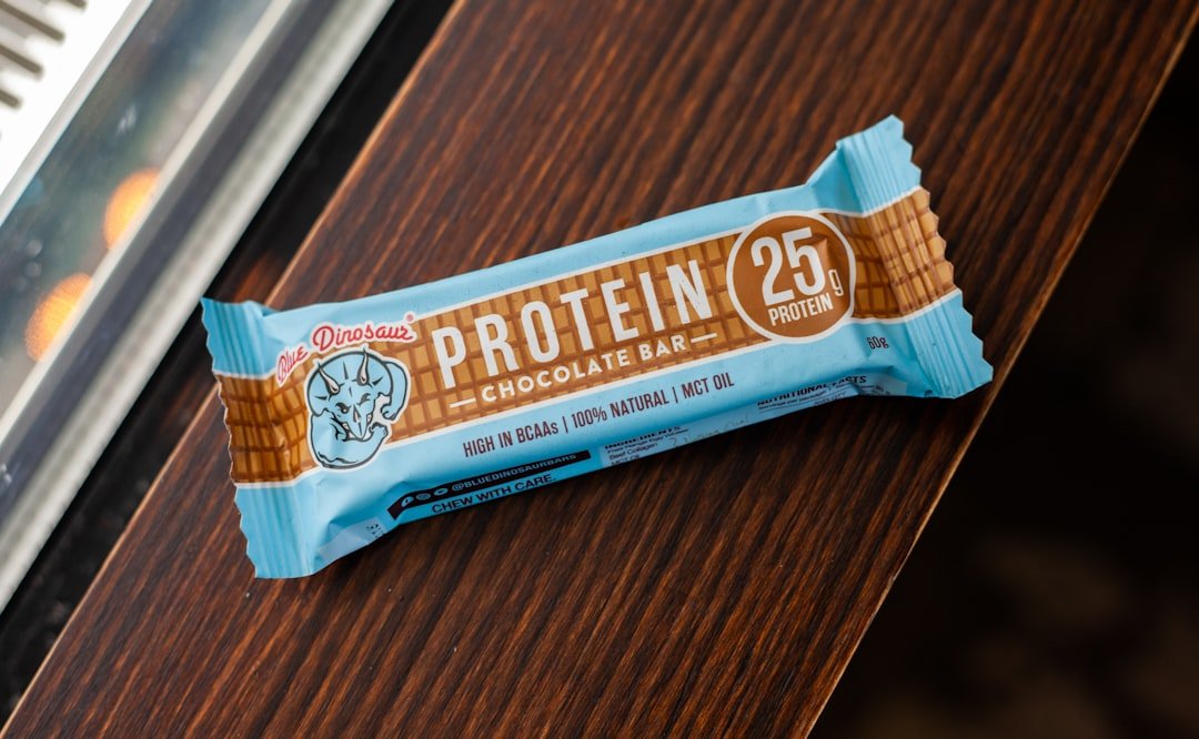 Protein bar and healthy snacks arranged on table