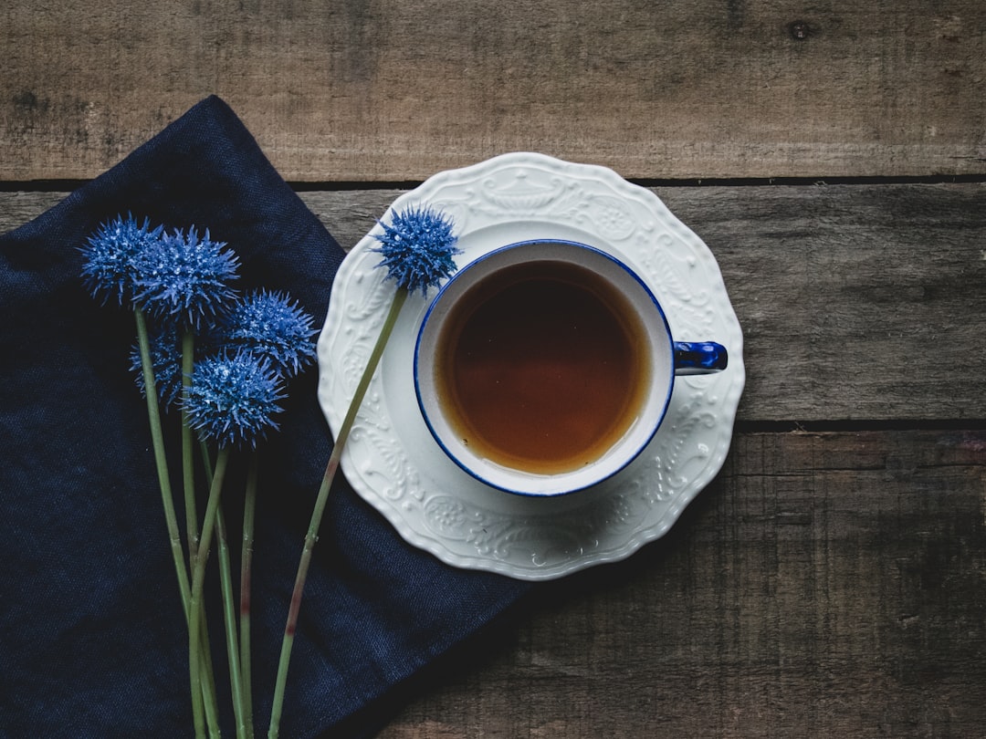 Herbal tea in a cup on a wooden table for afternoon relaxation