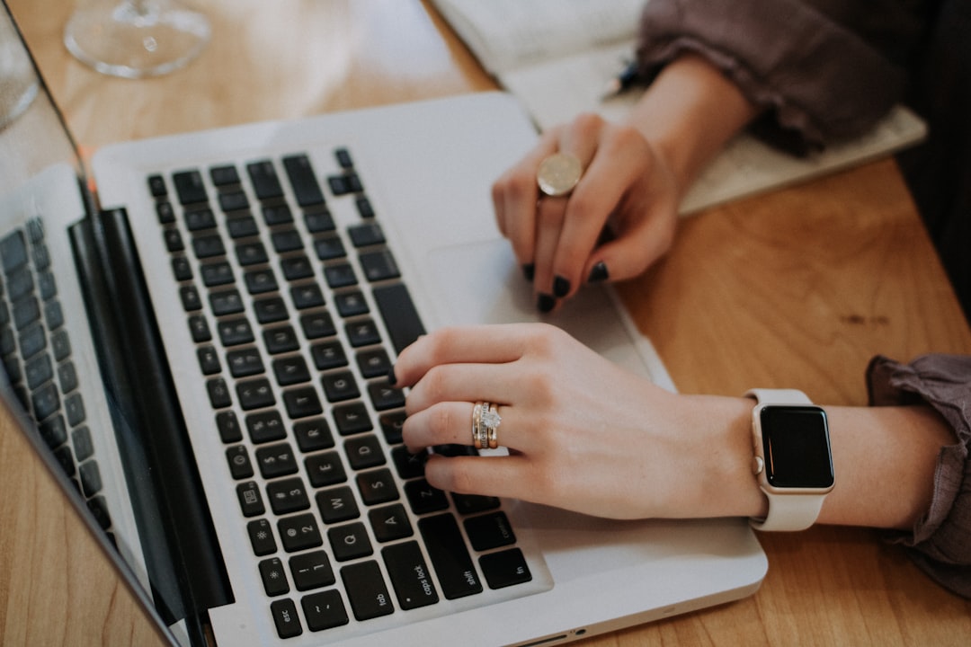 Laptop with notebook for planning wellness purchases