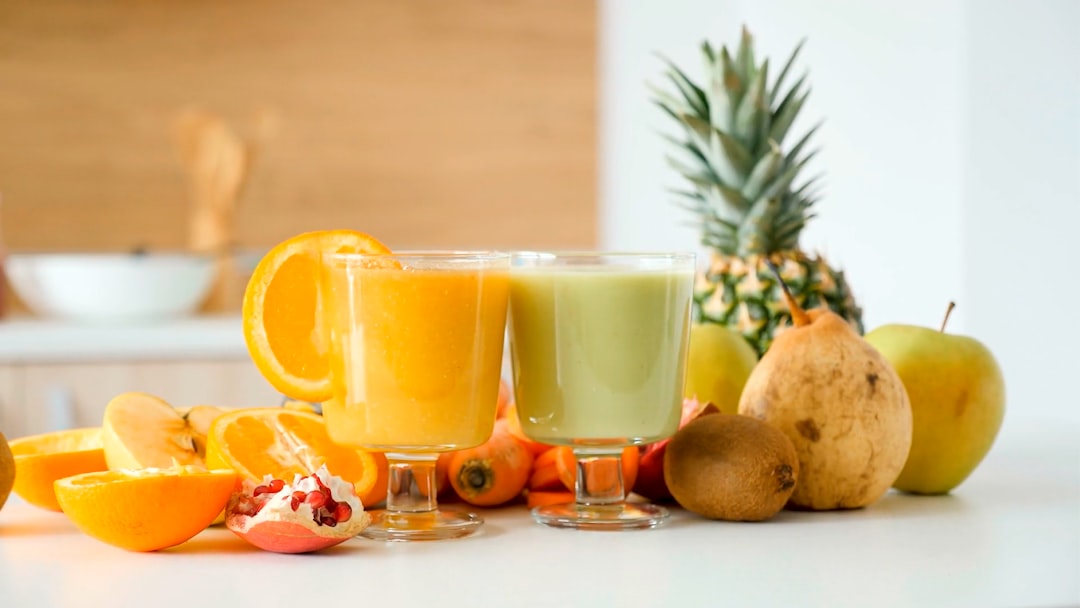 Personal blender with smoothie ingredients on a kitchen counter