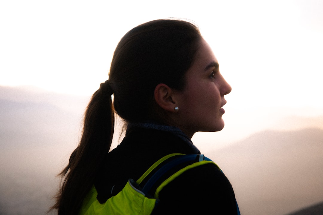 Runner wearing reflective safety vest in low light