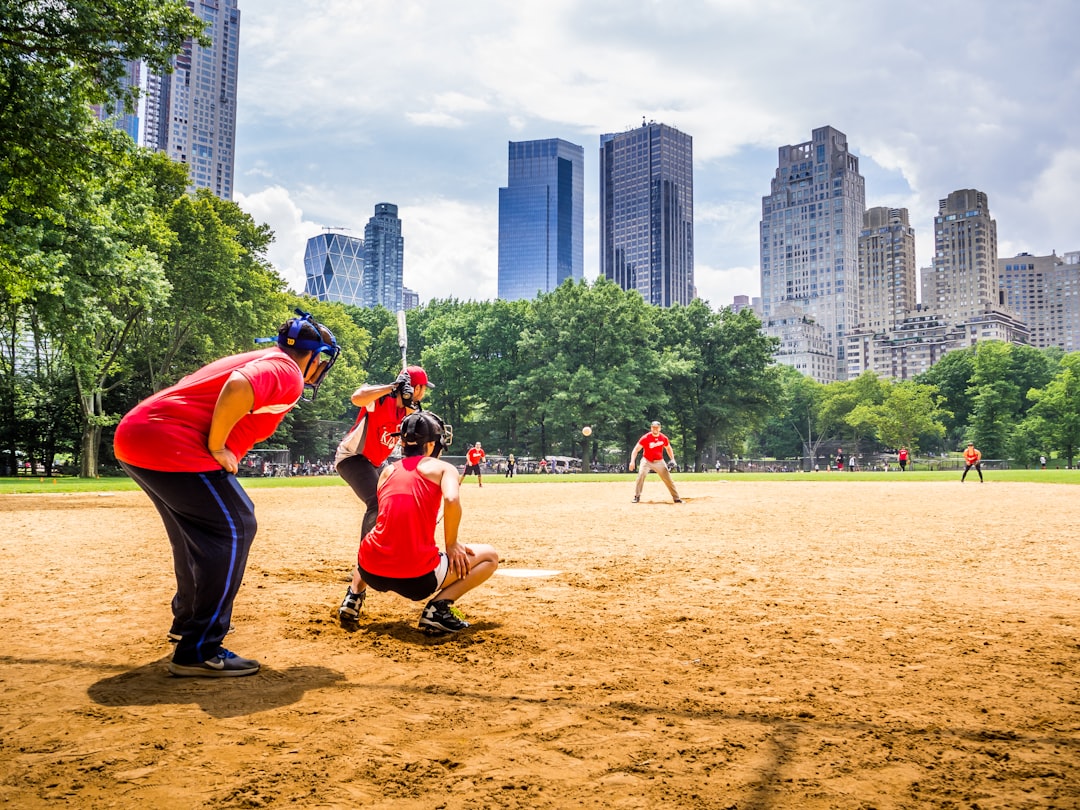Friends playing catch in a park