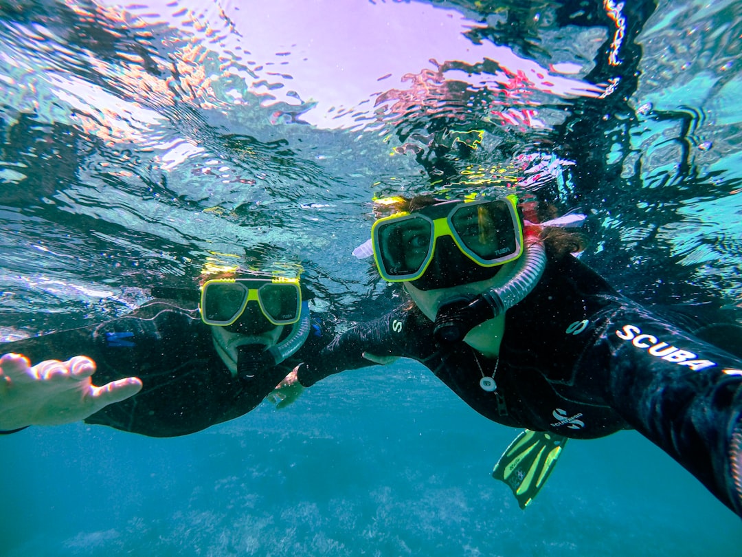 Snorkeling in clear blue ocean water