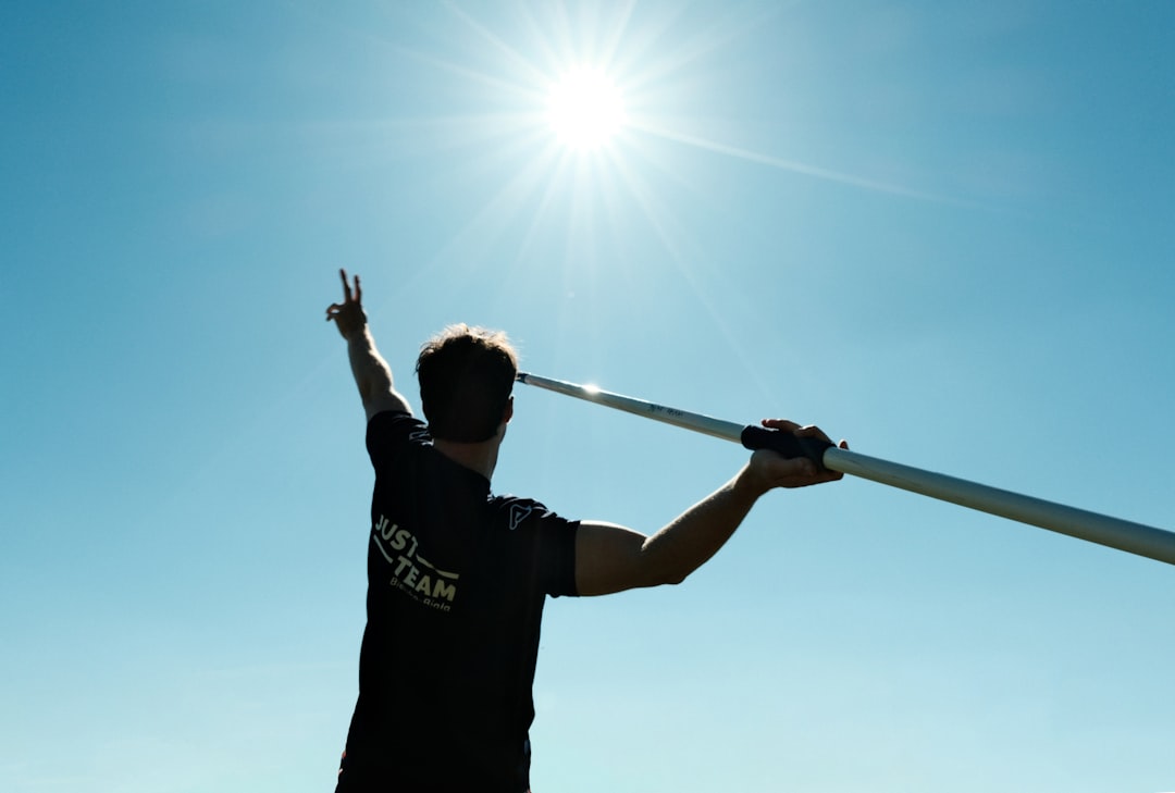Athlete applying sunscreen before outdoor training