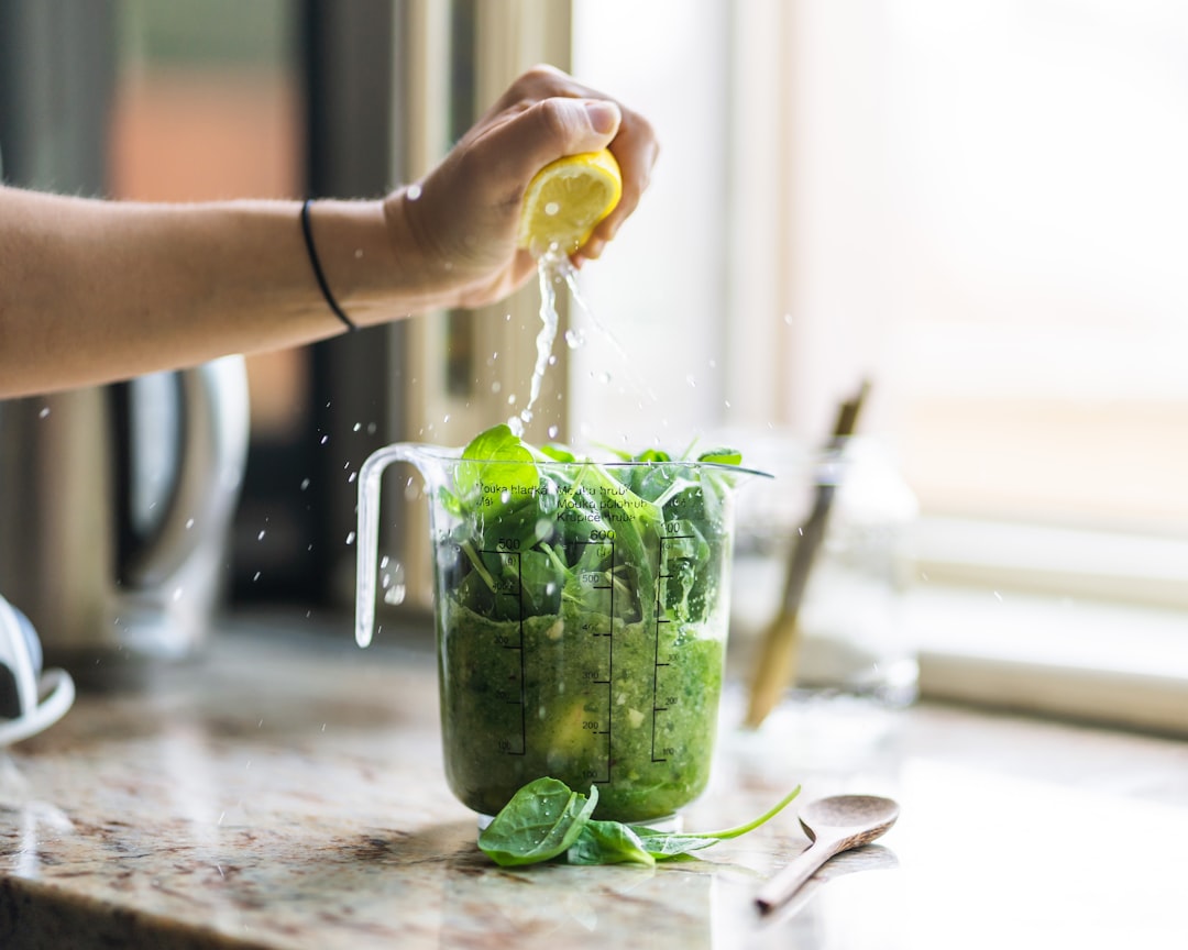 Green superfood powder mixed into a vibrant wellness drink