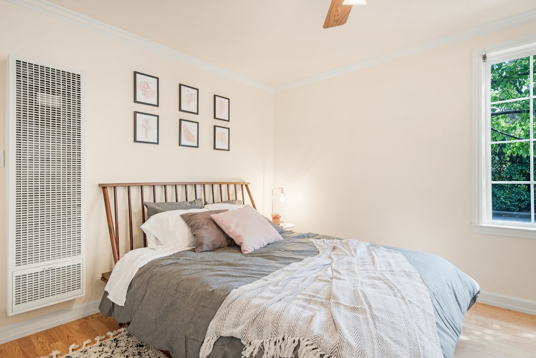Quiet tower fan circulating air in bedroom