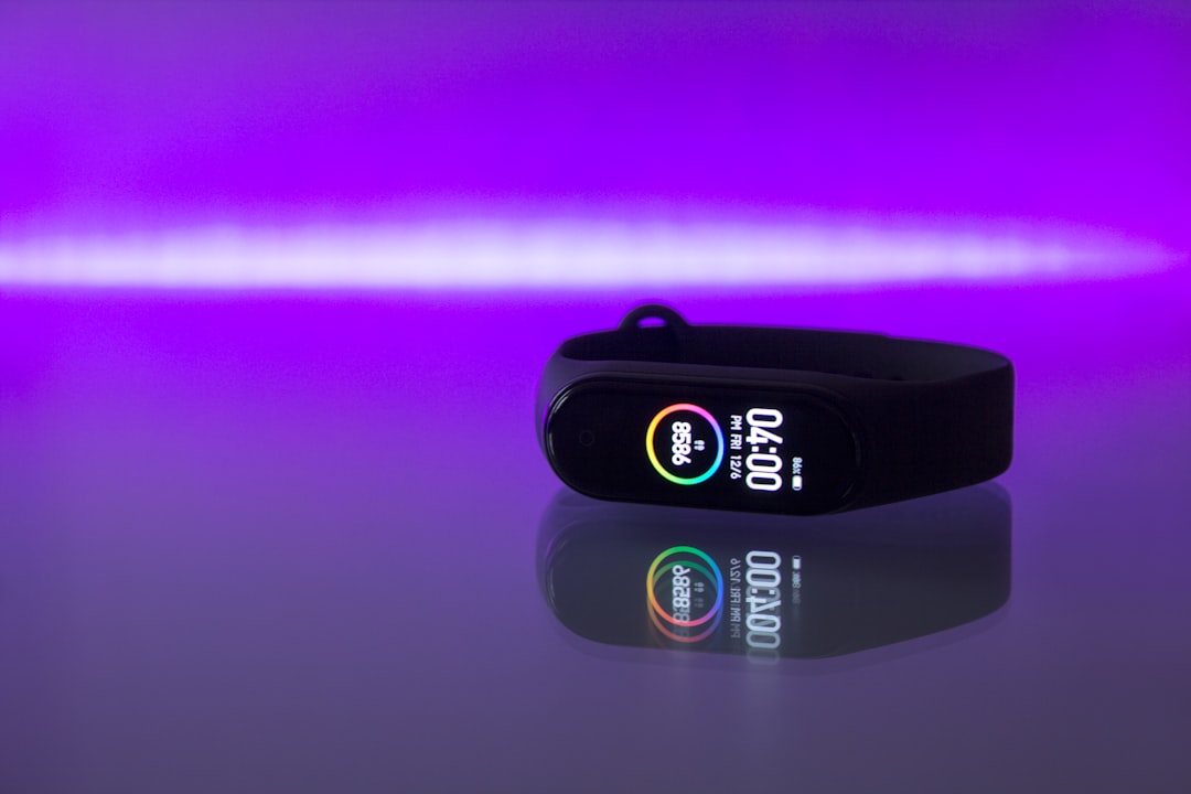 Fitness tracker on wrist showing workout data