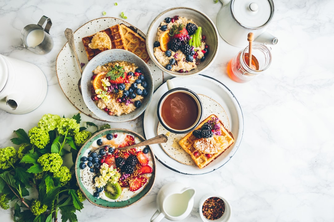 Healthy breakfast table spread with fruits and whole grains