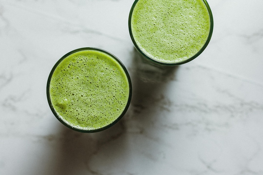 Green plant-based protein smoothie with fresh ingredients