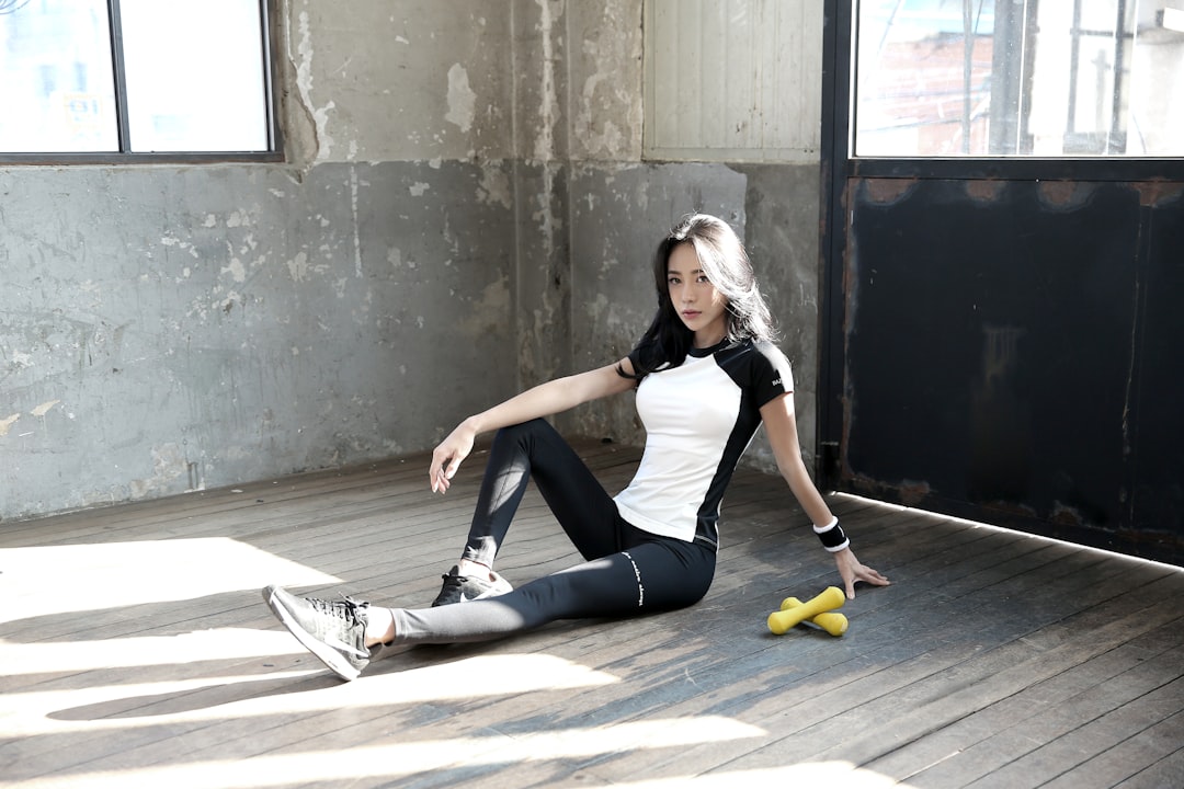 Athlete using a foam roller on tight leg muscles after a run