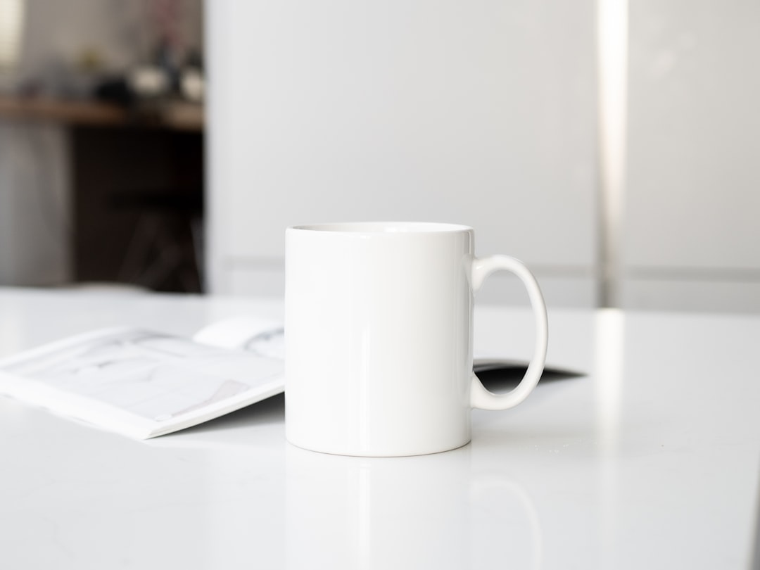 Warm bone broth served in a ceramic mug on a kitchen counter