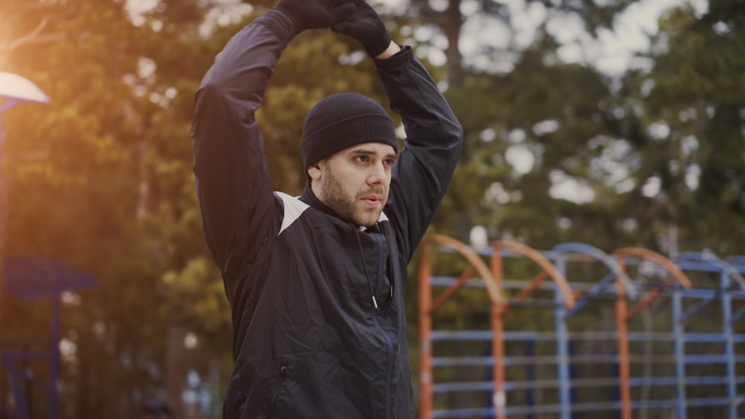 Runner stretching outdoors after a training session