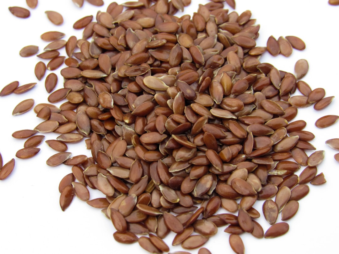Ground flaxseed powder in bowl with scoop