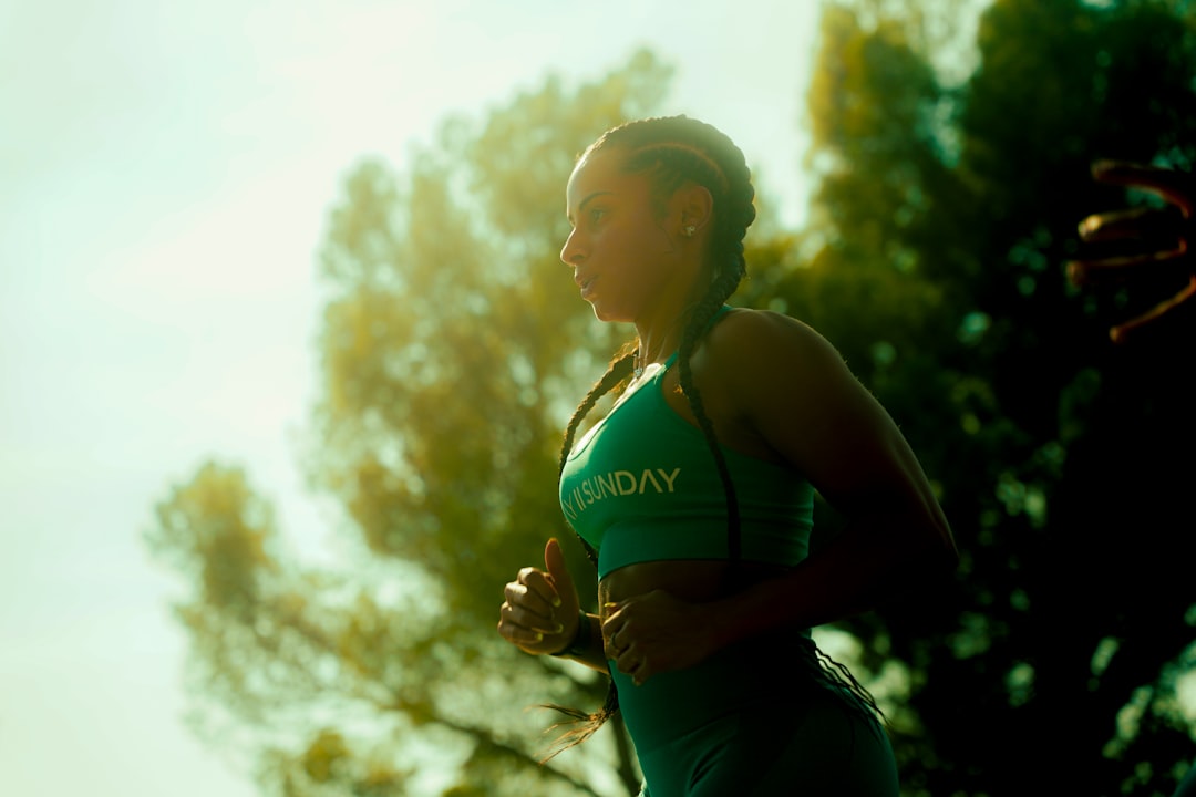 Athlete training in intense summer heat, sweat visible on skin