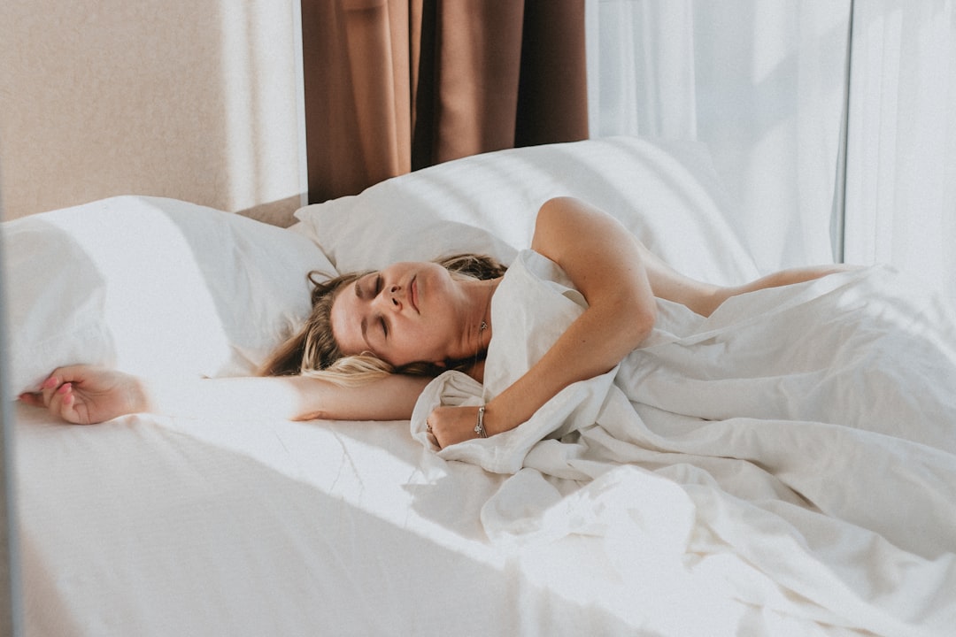 Woman sleeping peacefully in bedroom