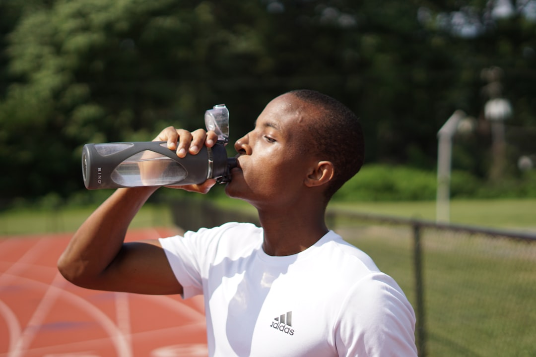 Athlete resting and hydrating after a hard training session