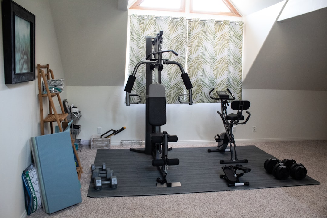 Attic home gym setup with equipment and mats