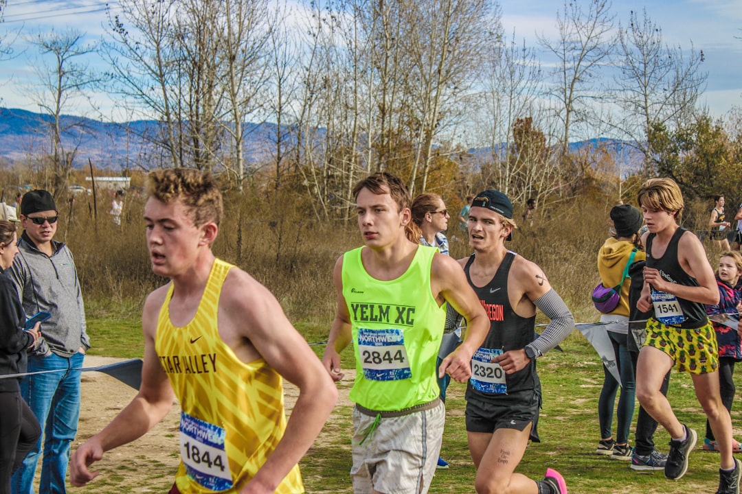 Cross-country runners racing on an autumn course