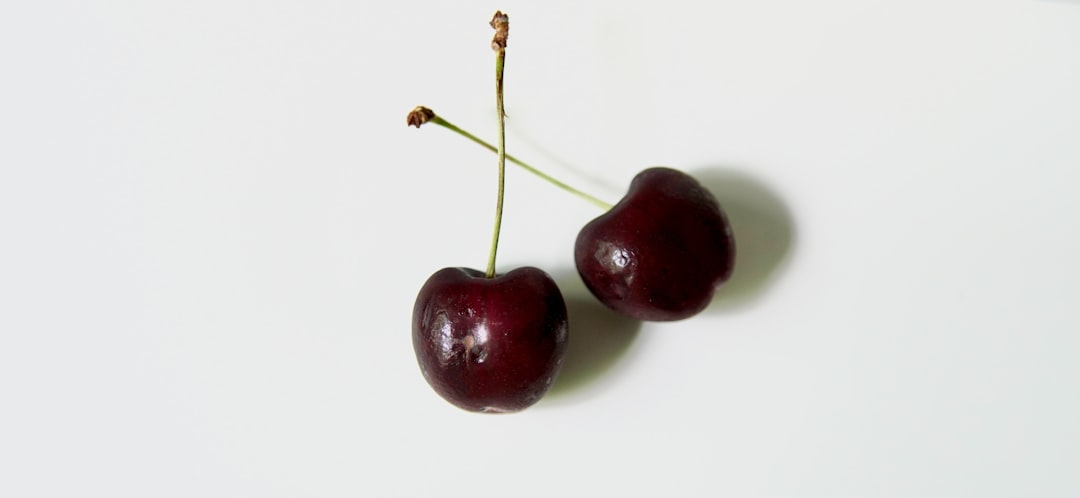 A glass of tart cherry juice on a kitchen counter