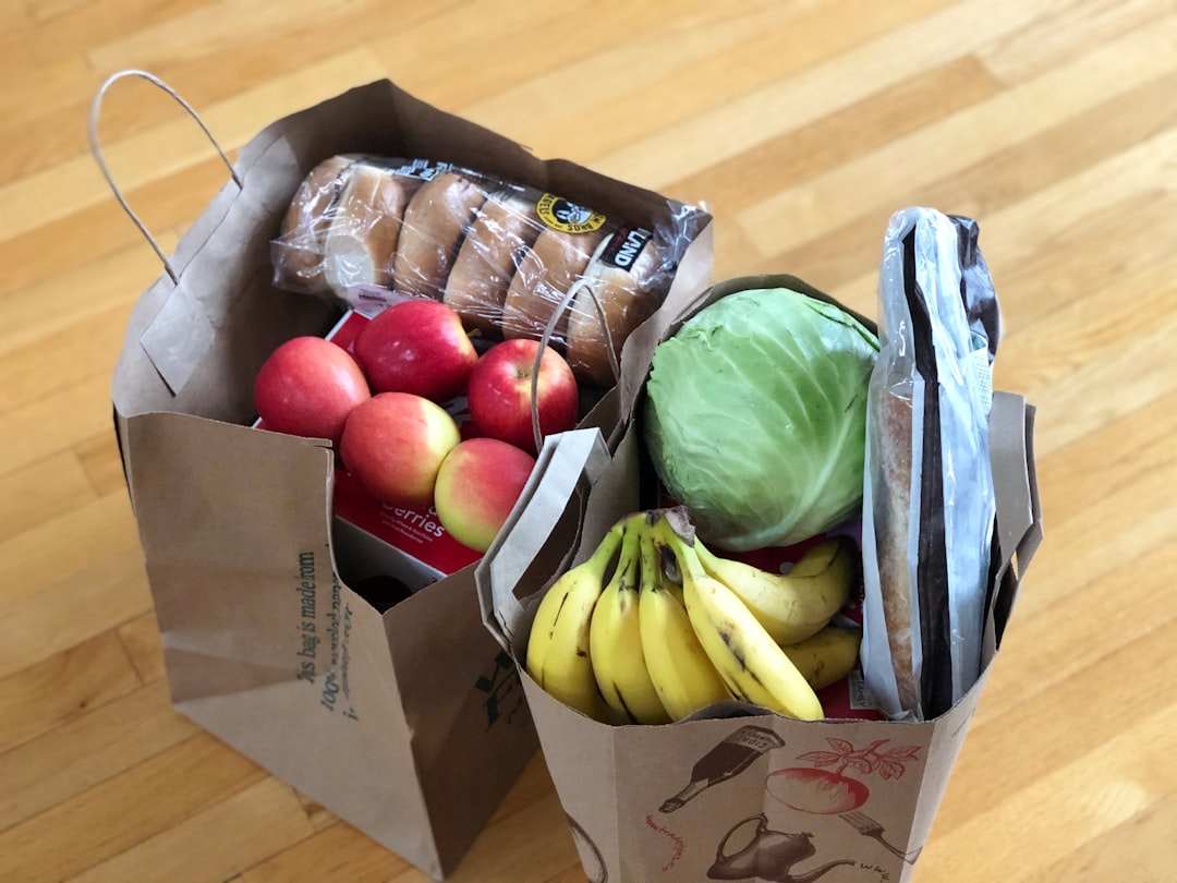 Insulated cooler bag filled with fresh groceries and produce