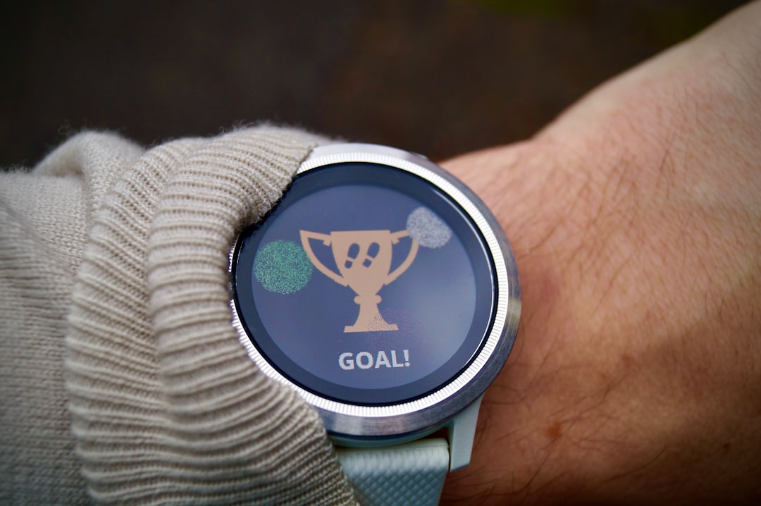 Fitness watch on a wrist showing a step goal