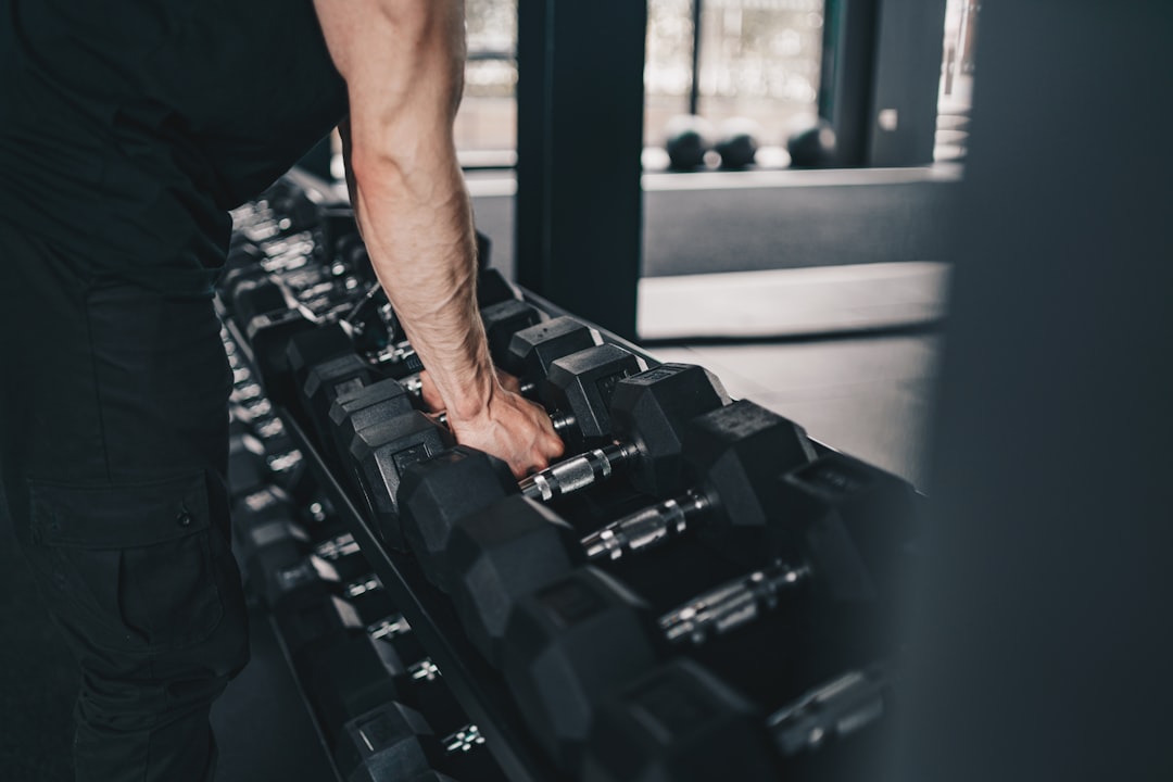 Athlete training with weights in gym