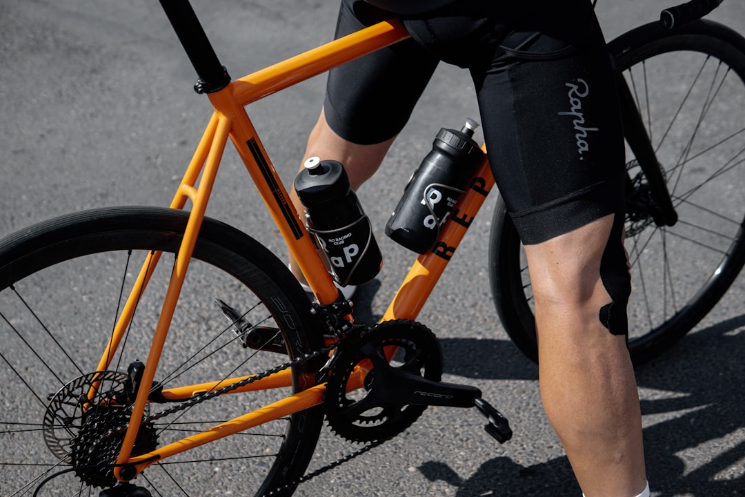 Cyclist carrying water bottles on a long ride