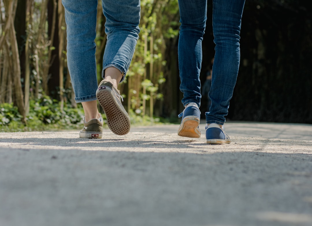 Close-up of feet walking in cushioned sneakers